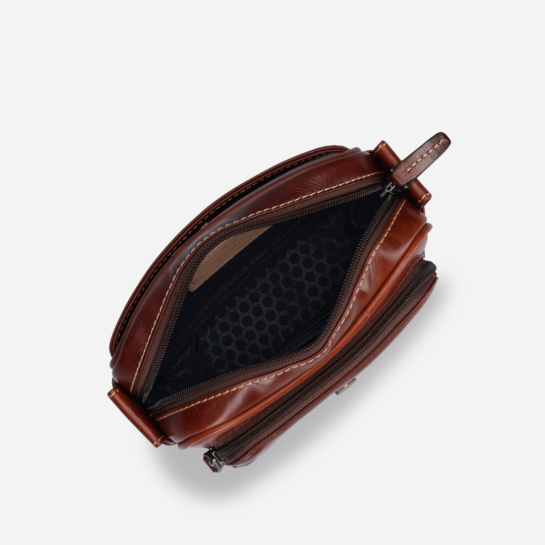 Top view of Jekyll and Hide - Small Travel Crossbody Bag - Mocha highlighting zip compartments.