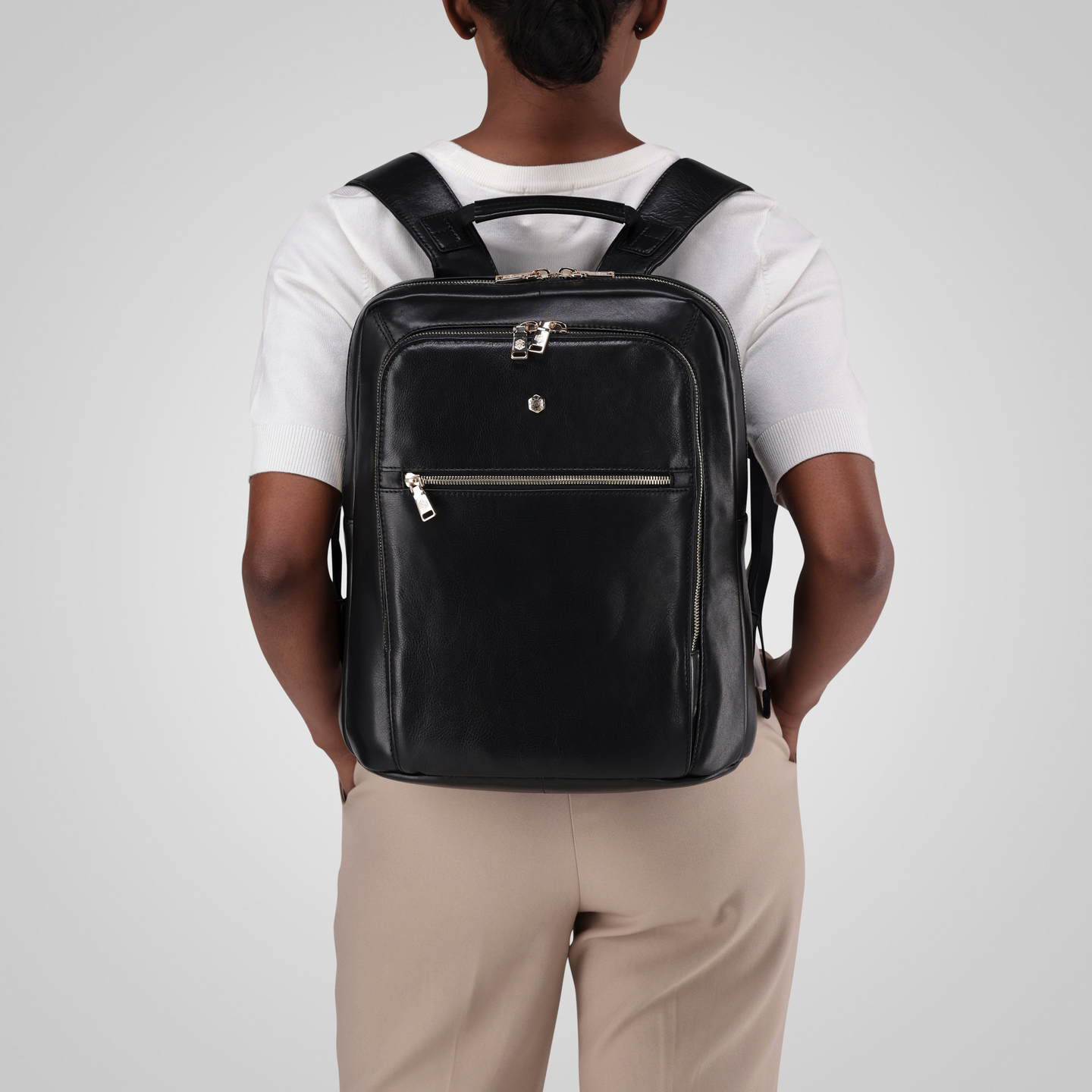 Jekyll and Hide - Ladies Business Backpack 38cm - Black | Tan worn on back by woman, showcasing stylish design and functionality.