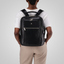 Jekyll and Hide - Ladies Business Backpack 38cm - Black | Tan worn on back by woman, showcasing stylish design and functionality.