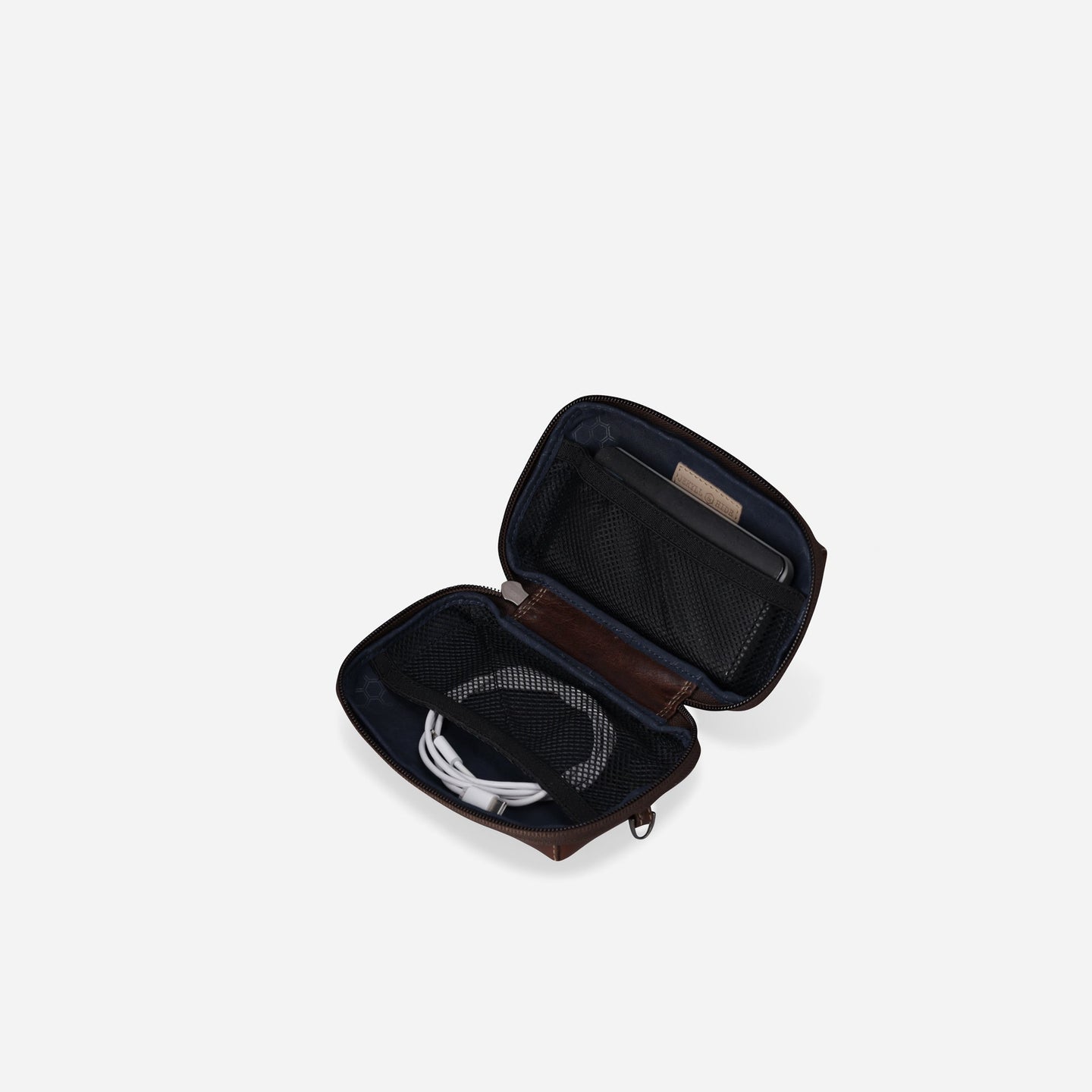 Jekyll and Hide - Compact Zip Around Cable Pouch - Tan | Black | Mocha opened with tech accessories organized inside.