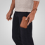 Jekyll and Hide - Compact Zip Around Cable Pouch - Tan | Black | Mocha being held by a man in casual attire.