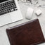 Jekyll and Hide - Zip Around A4 Tablet Folder - Tan | Coffee | Black on marble desk with laptop and accessories.
