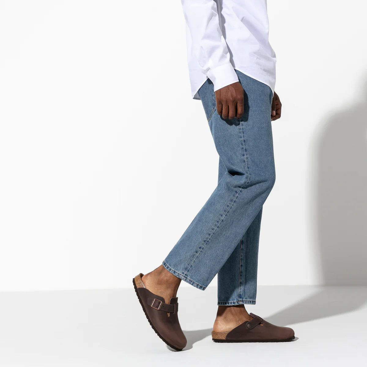 Birkenstock - Boston Oiled Leather - Regular Fit - Habana worn with blue jeans, showcasing a stylish and versatile look.