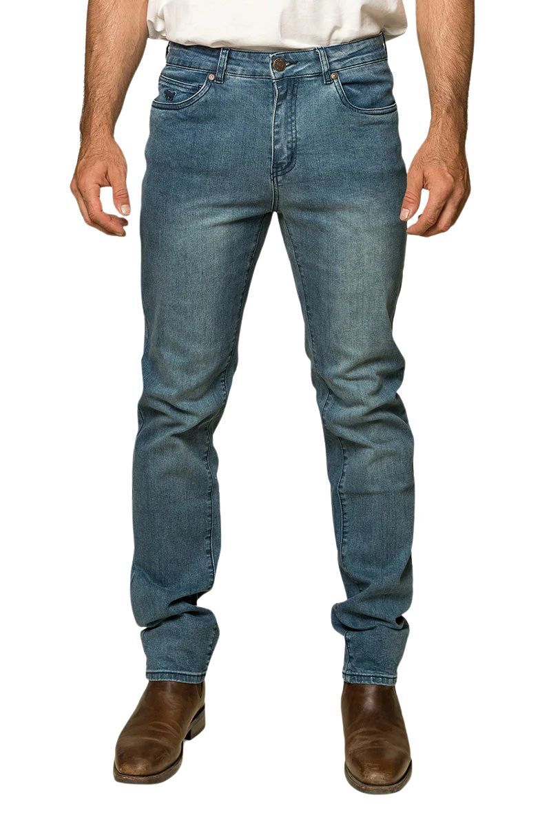 Ringers Western - Burke Mens Tapered Slim Leg Jeans- Light Blue displayed on a model wearing brown boots.