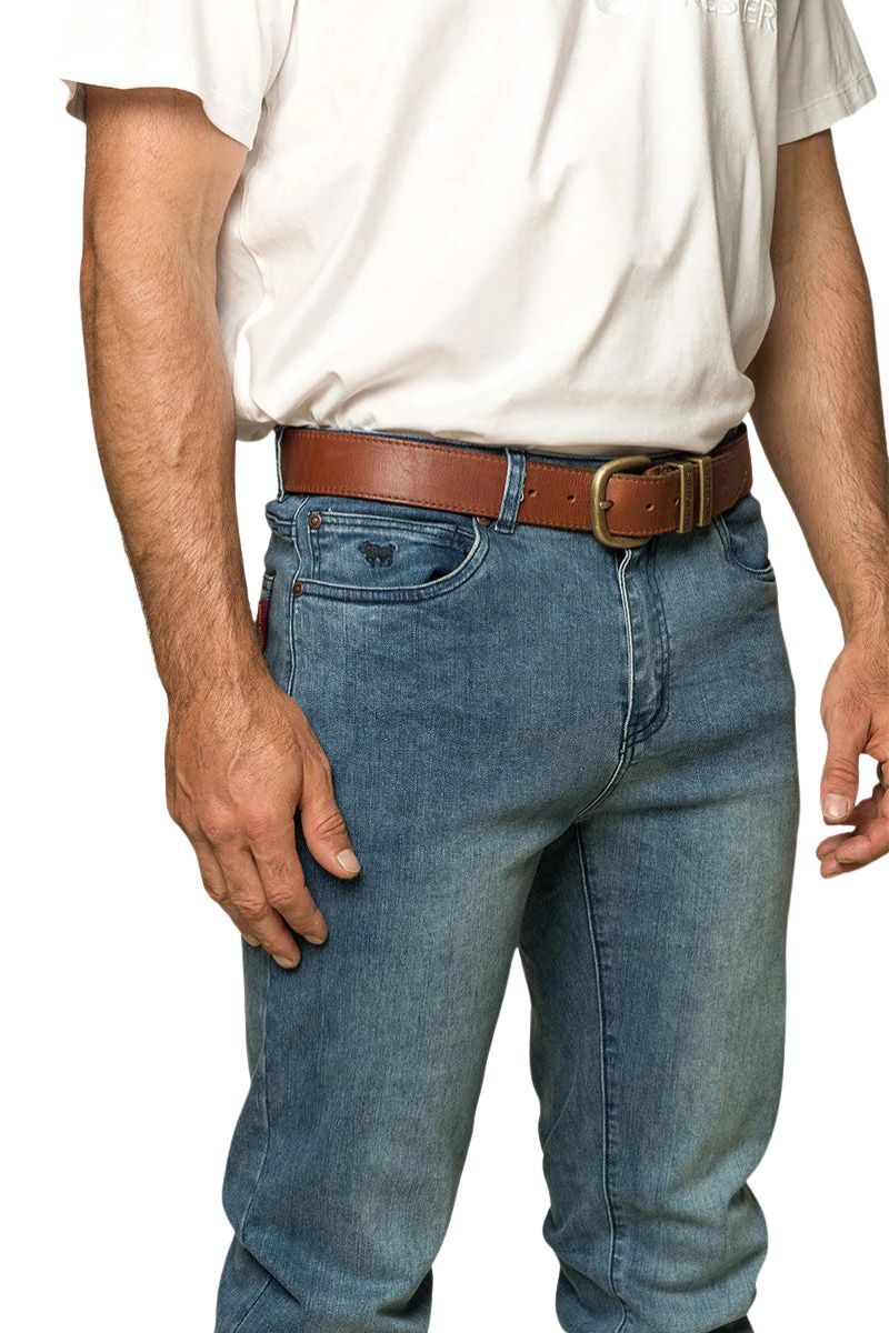 Ringers Western - Burke Mens Tapered Slim Leg Jeans- Light Blue showcased on a model with a brown belt.