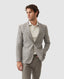 Rodd & Gunn - Cascades Jacket - Mink modeled by a man in a light grey blazer and cream shirt, showcasing a sophisticated look.