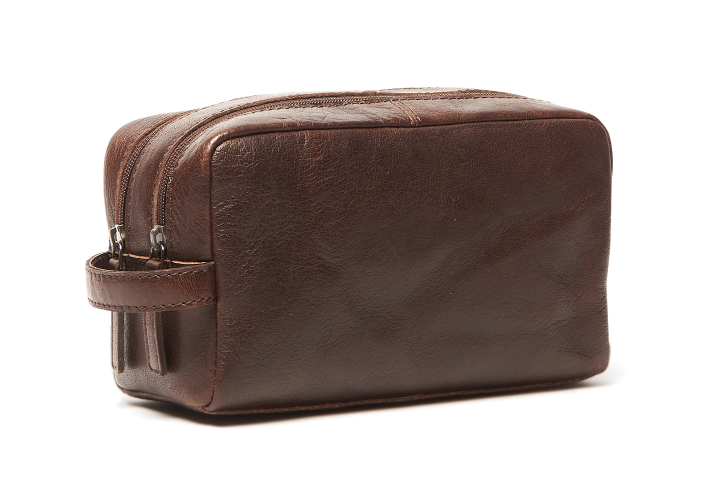 Oran Leather - Corso Wash Bag - Brown shown in side view, featuring zippered sections and a carry handle.