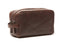 Oran Leather - Corso Wash Bag - Brown shown in side view, featuring zippered sections and a carry handle.