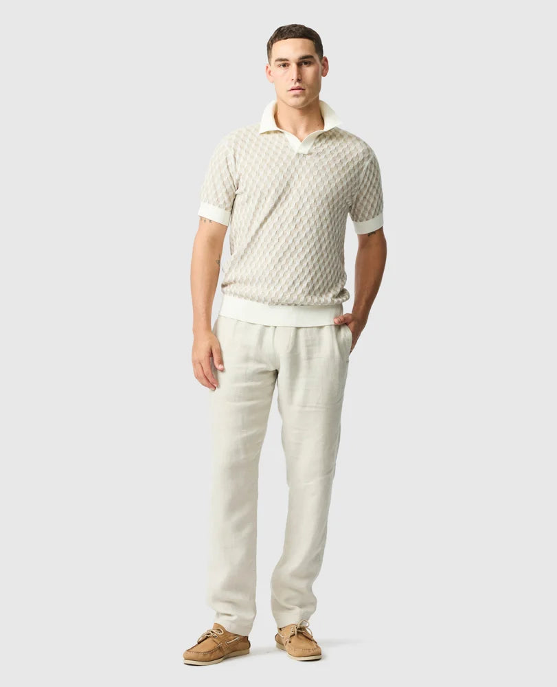 Rodd & Gunn - Galdfield Knit Polo - Cream worn by a model, showcasing its geometric stitch design and breathable fabric.