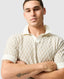 Rodd & Gunn - Galdfield Knit Polo - Cream on a model, showcasing the intricate geometric stitch design and solid collar.