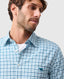 Rodd & Gunn - Gebbies Valley Linen Shirt - Check - Lagoon on a model with a close-up of the gingham pattern.