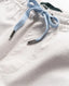 Rodd & Gunn - Gunn 7" Resort Short - Coconut - MULTIBUY close-up of elasticated waist and drawcord detail.
