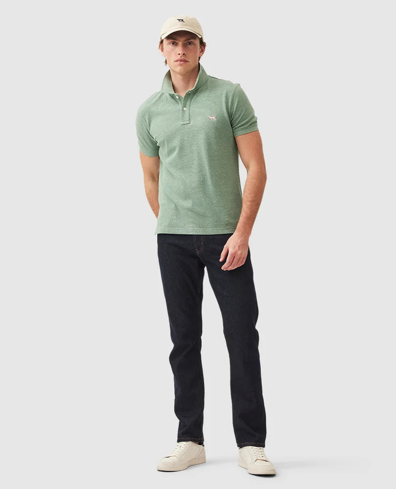Rodd & Gunn - The Gunn Polo - Dusty Sage - MULTIBUY model wearing the polo shirt, paired with dark jeans and a cap.
