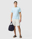 Rodd & Gunn - The Gunn T-Shirt 2.0 - Ice Blue - MULTIBUY worn by model with navy bag and shorts.