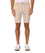 A person wearing light beige drawstring shorts, shown from the waist down against a plain light gray studio background. The shorts have a white drawstring and are paired with white sneakers.