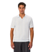 A man wearing a light blue short-sleeve knit polo shirt with subtle vertical stripes, paired with dark gray trousers, against a plain light gray background.