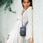 Jekyll and Hide - Womens Small Mobile Phone Sling Purse - Mulitple Colours worn crossbody by a model in a white dress.