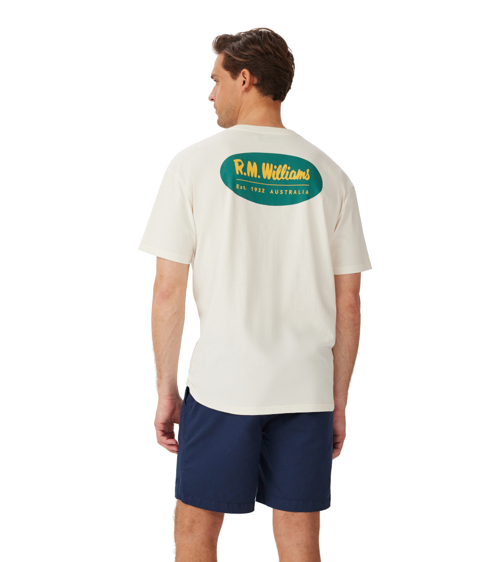 Model showcasing the R.M.Williams - 90s Logo T-Shirt - White from the back, featuring classic logo design.