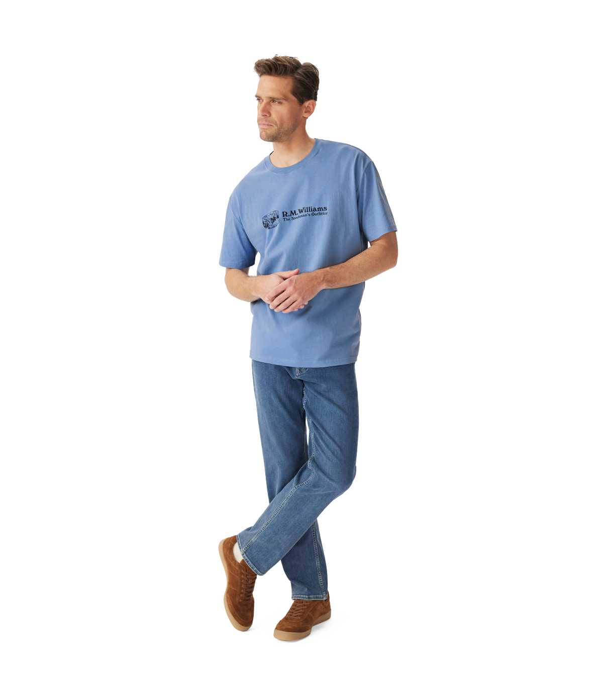 R.M.Williams - Outfitter T-Shirt - Soft Blue worn by a model, featuring crew neck and branded print.
