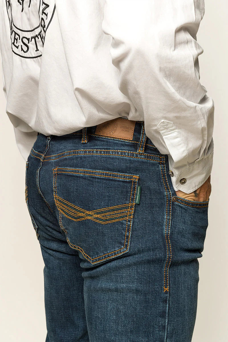 Ringers Western - Muster Slim Straight Fit Jeans- Dark Wash Blue worn by a model showcasing the back detail.
