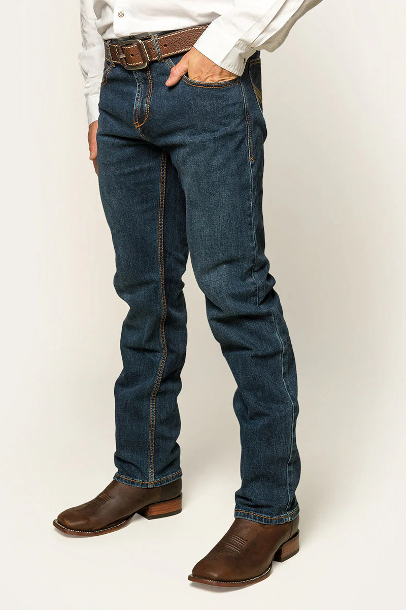Ringers Western - Muster Slim Straight Fit Jeans- Dark Wash Blue worn by a model, showcasing a stylish mid-rise design.