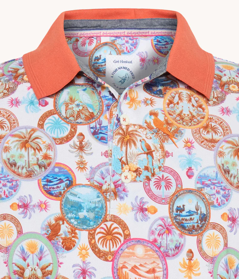 A Fish Named Fred - Desert World Polo - Orange featuring a vibrant desert landscape print and contrast collar.