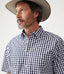 R.M.Williams - Hervey Shirt - Short Sleeve - Check - Navy & White worn by a man, showcasing the durable twill cotton fabric.