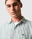Rodd & Gunn - Seadown Linen Shirt - Stripe - Forest displayed on male model, showcasing vertical stripes and a modern look.