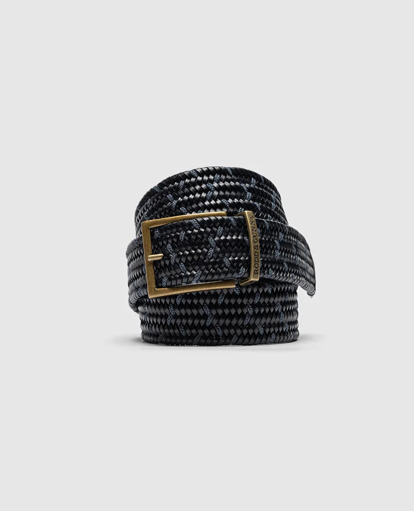 Rodd & Gunn - Stratford Stretch Belt - Leather - Navy displayed in a coiled position with antique finished buckle.