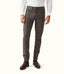 R.M.Williams - Loxton 5 Pocket Jean - Silt worn by a model, showcasing a closer fit and tapered leg, paired with brown boots.