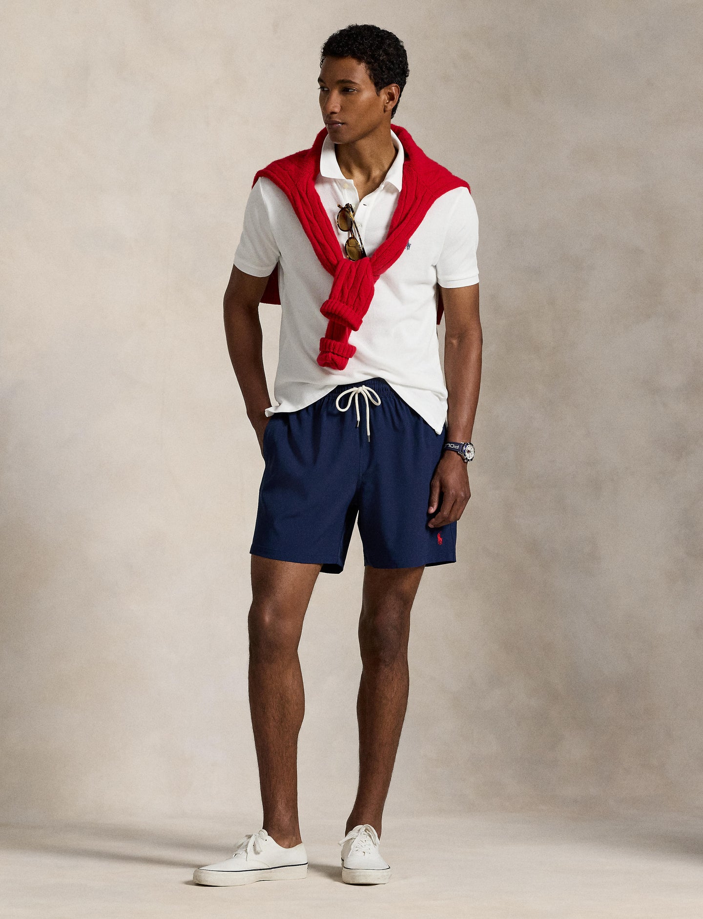Model wearing Polo Ralph Lauren - Traveller Classic Swim Trunk - Navy with a white polo and red sweater.