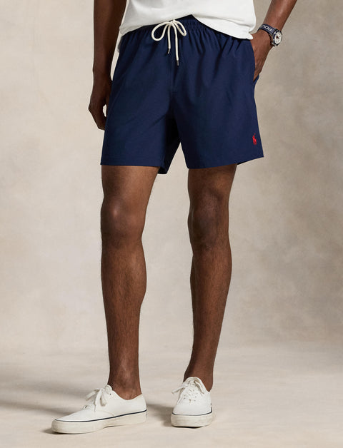 Polo Ralph Lauren - Traveller Classic Swim Trunk - Navy displayed by a model, showcasing elastic drawstring waistband and classic fit.