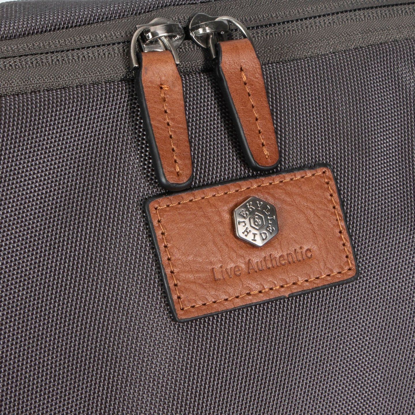 Jekyll and Hide - Shirt & Laundry Travel Bag - Grey close-up of zipper and logo detail.