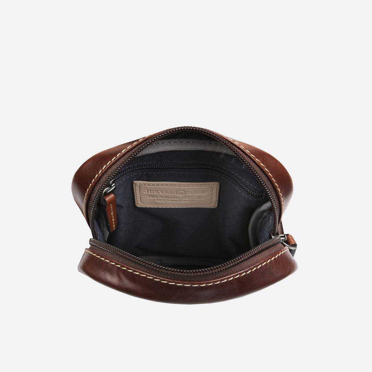 Inside view of Jekyll and Hide - Small Crossbody Organiser - Mocha | Tan | Black showcasing spacious interior.