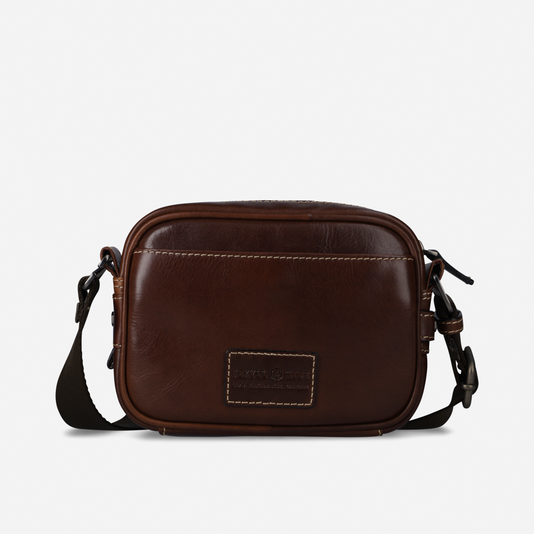 Jekyll and Hide - Small Travel Crossbody Bag - Mocha in rich brown leather, featuring adjustable strap and zip compartments.