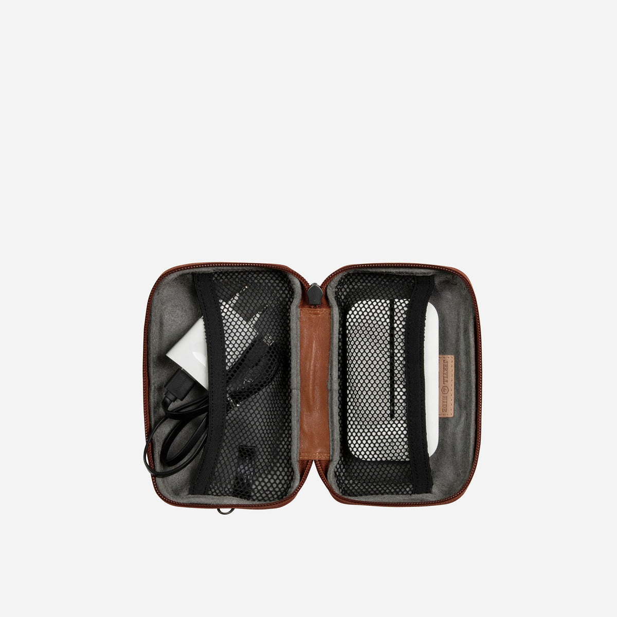 Jekyll and Hide - Compact Zip Around Cable Pouch - Tan | Black | Mocha open showing organized tech accessories inside.