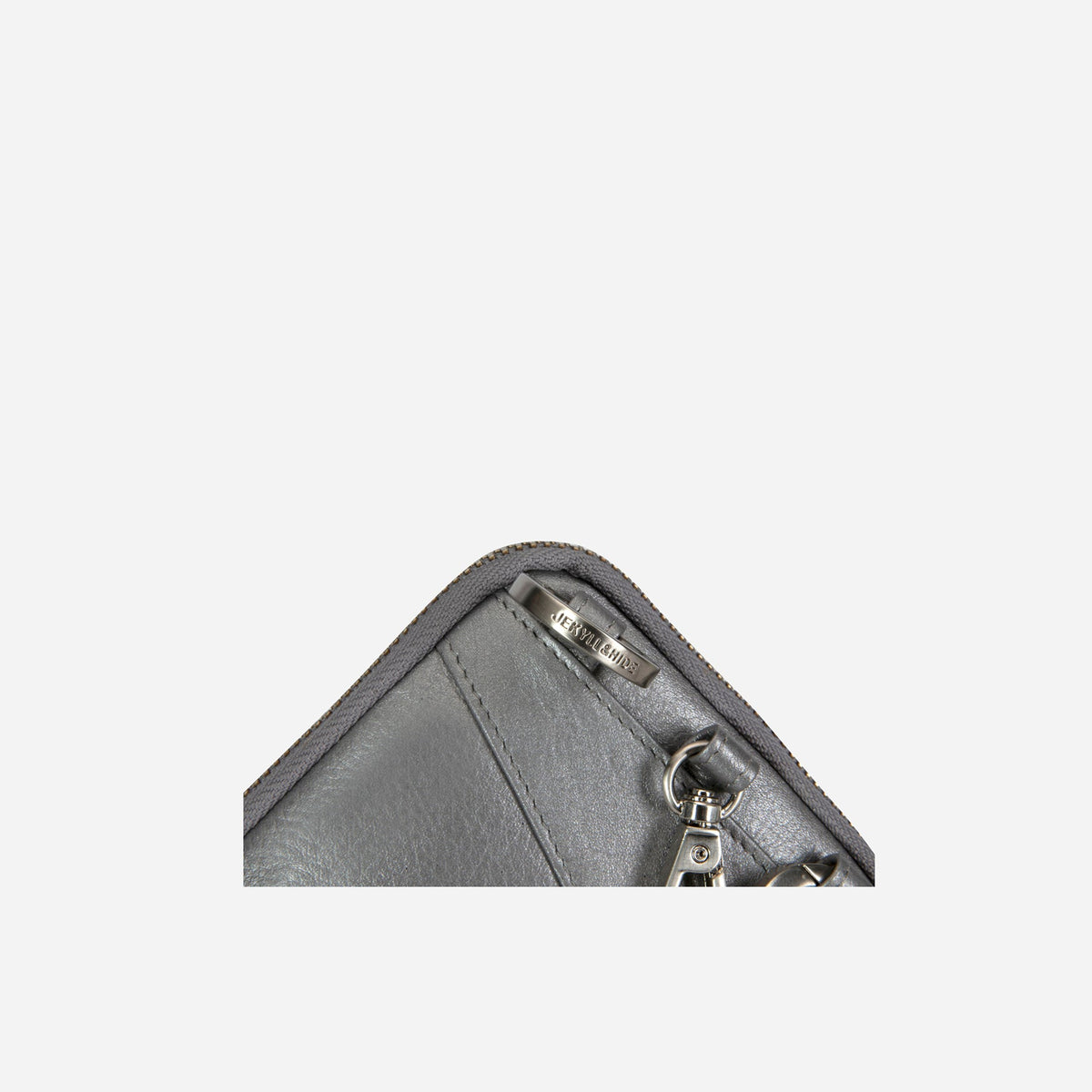 Jekyll and Hide - Mobile Phone Pouch With Strap - Black | Tan | Multiple Colours - close-up view of zipper and leather detailing.