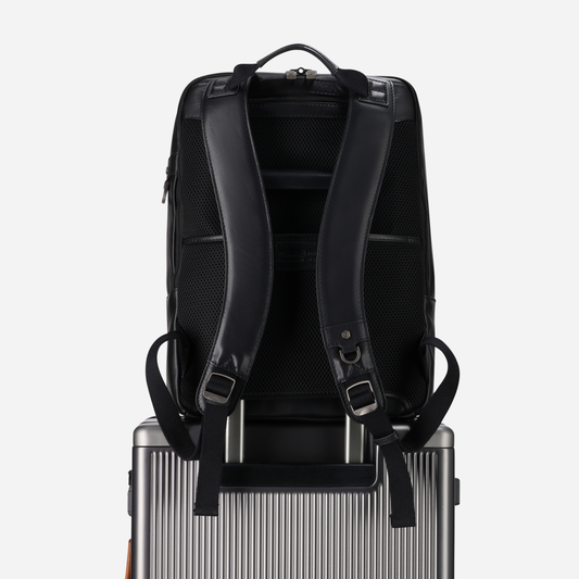 Jekyll and Hide - 17" Laptop Backpack - Colt | Black on top of luggage with ergonomic straps
