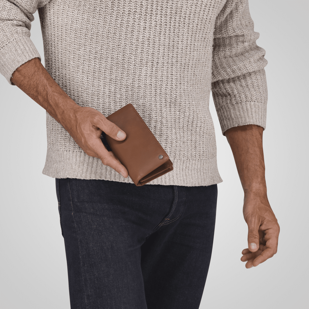 Jekyll and Hide - Large Travel And Mobile Wallet - Tan | Mocha | Black being held in hand, showcasing its sleek design.