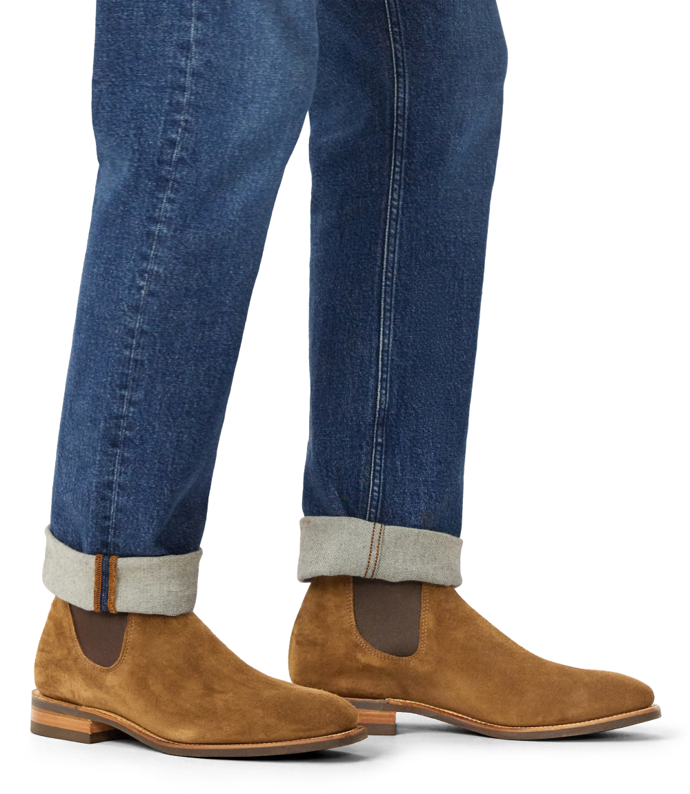 R.M.Williams cedar suede Chelsea boots worn with dark trousers.