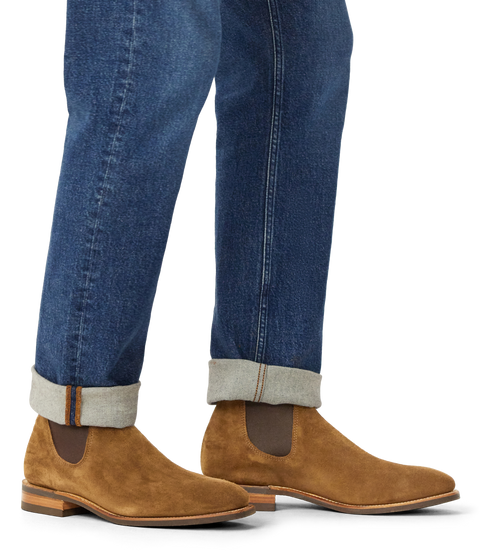 R.M.Williams cedar suede Chelsea boots worn with dark trousers.