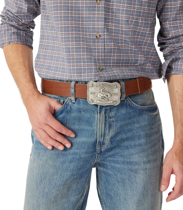 R.M.Williams - Cloudbuster Trophy Belt Buckle - Antique Silver Finish worn with a brown belt on a man in a checked shirt.