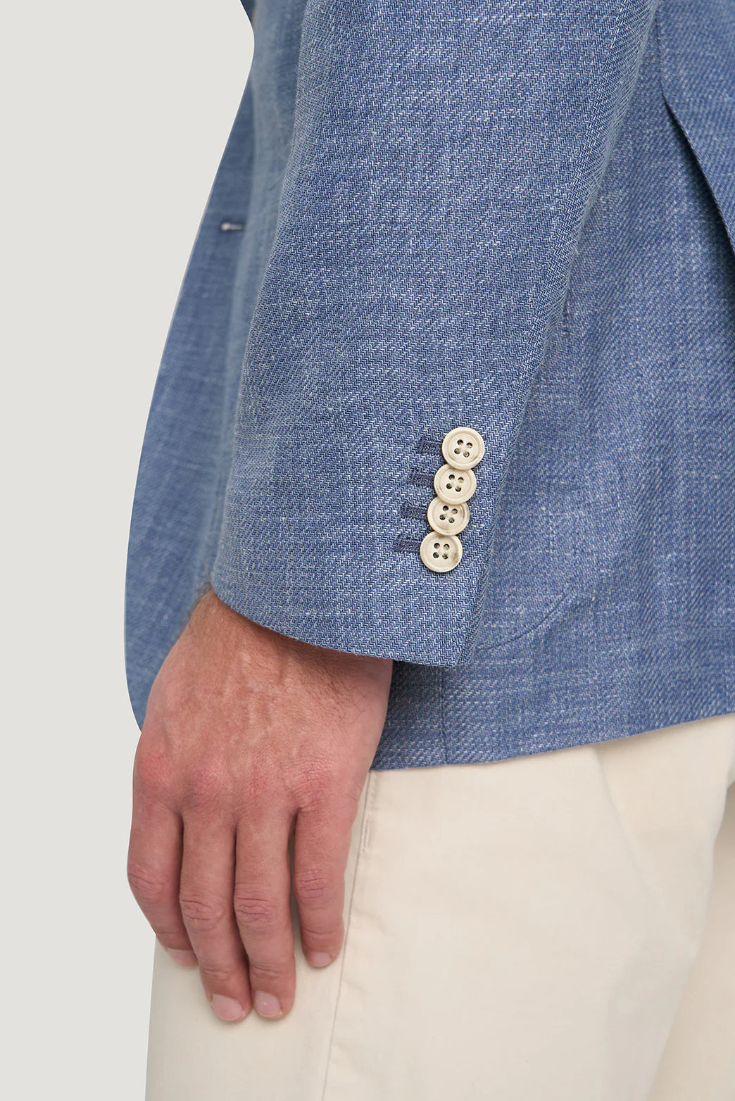 Detail of M.J.Bale - Beauford Jacket - Blue showcasing buttoned cuff and fabric texture.