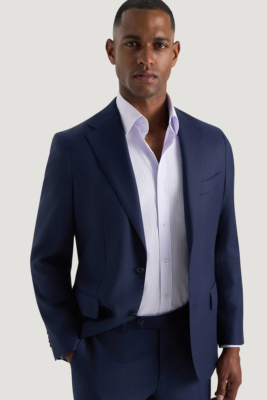 M.J. Bale - Beecher Shirt - Lilac - MULTIBUY worn under a tailored navy suit by a model.