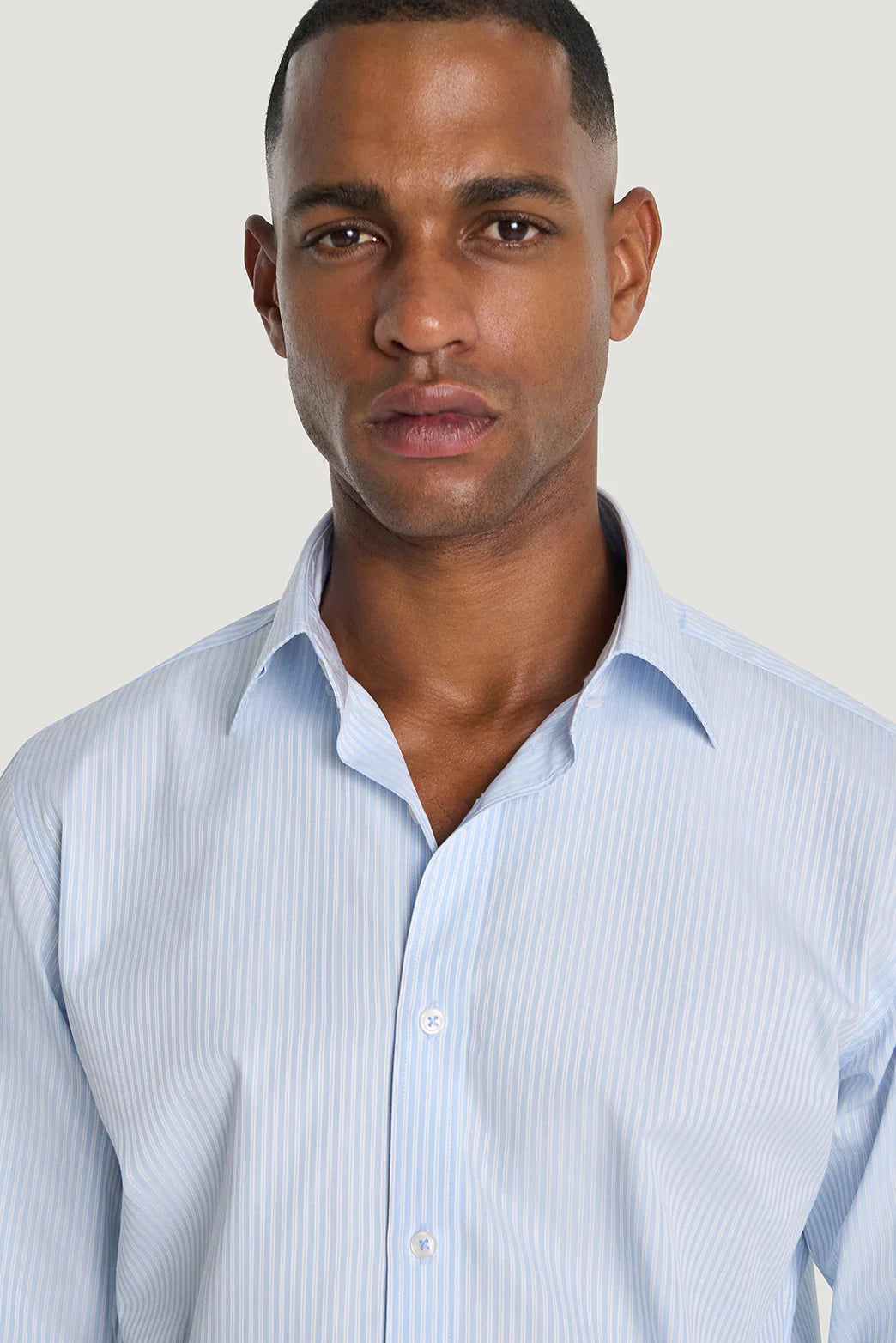 M.J. Bale - Beecher Shirt - Sky - MULTIBUY worn by a model, showcasing the stylish double-stripe pattern in light blue.