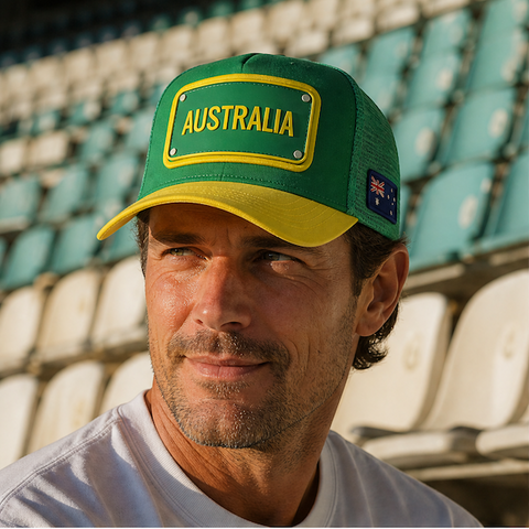 FIFA World Cup Australia Cap - Green. Man wearing a green and yellow cap with a logo in an outdoor setting.