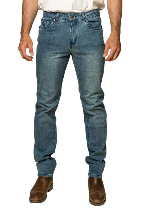 Ringers Western - Burke Mens Tapered Slim Leg Jeans- Light Blue displayed on a model wearing brown boots.