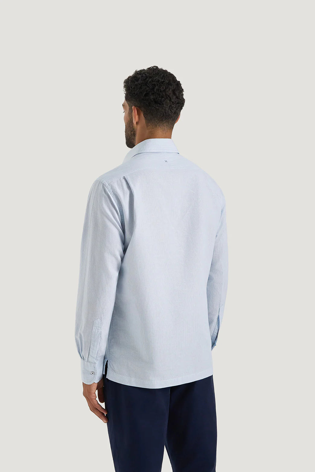 M.J. Bale - Caloundra Shirt - Micro Stripe - Sky - MULTIBUY: Men's back view wearing a light blue stripe half-placket shirt.