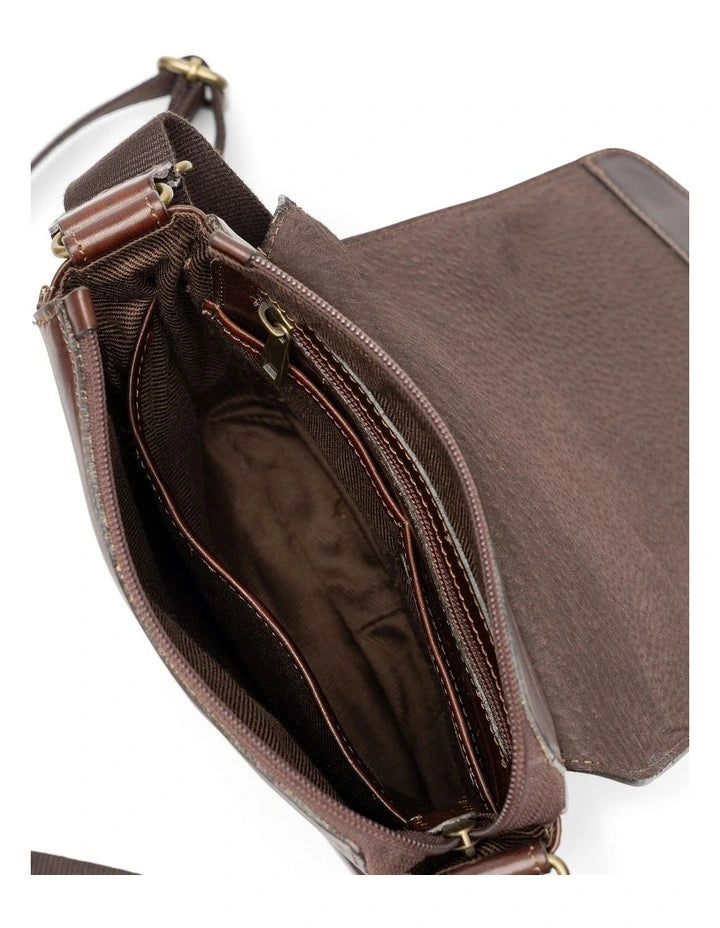 Interior view of Rodd & Gunn - Cambridge Mini Messenger Bag - Chocolate, showing pockets and zip closure.