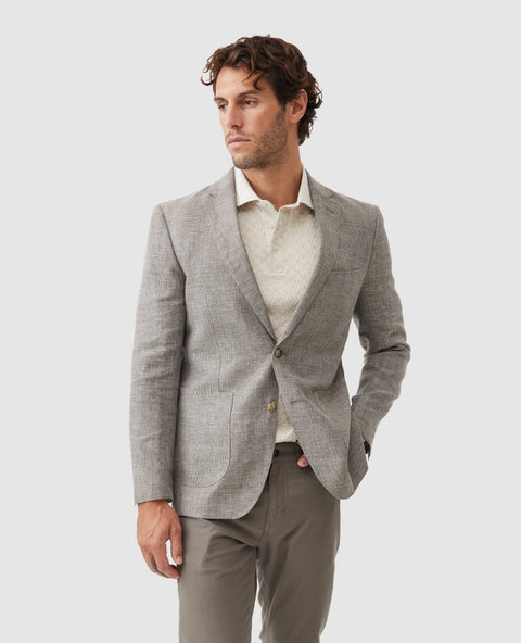Rodd & Gunn - Cascades Jacket - Mink modeled by a man in a light grey blazer and cream shirt, showcasing a sophisticated look.